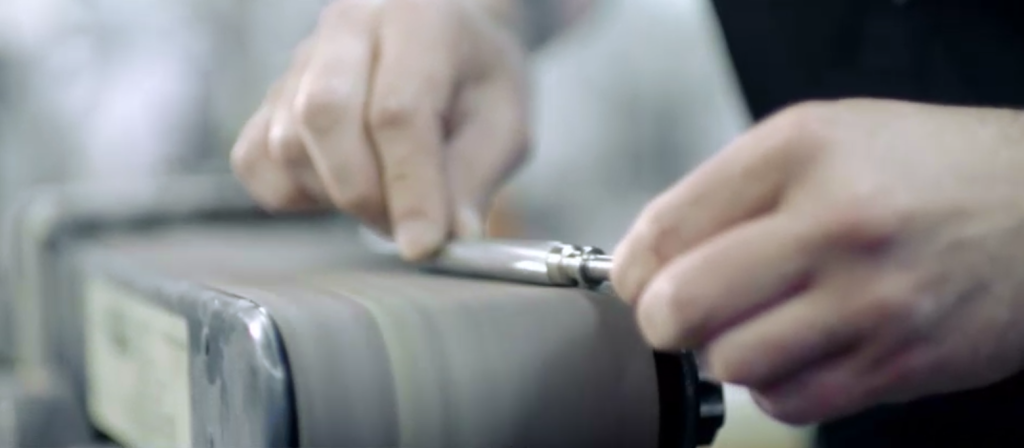 a prototype pen being handmade by a skilled engineer